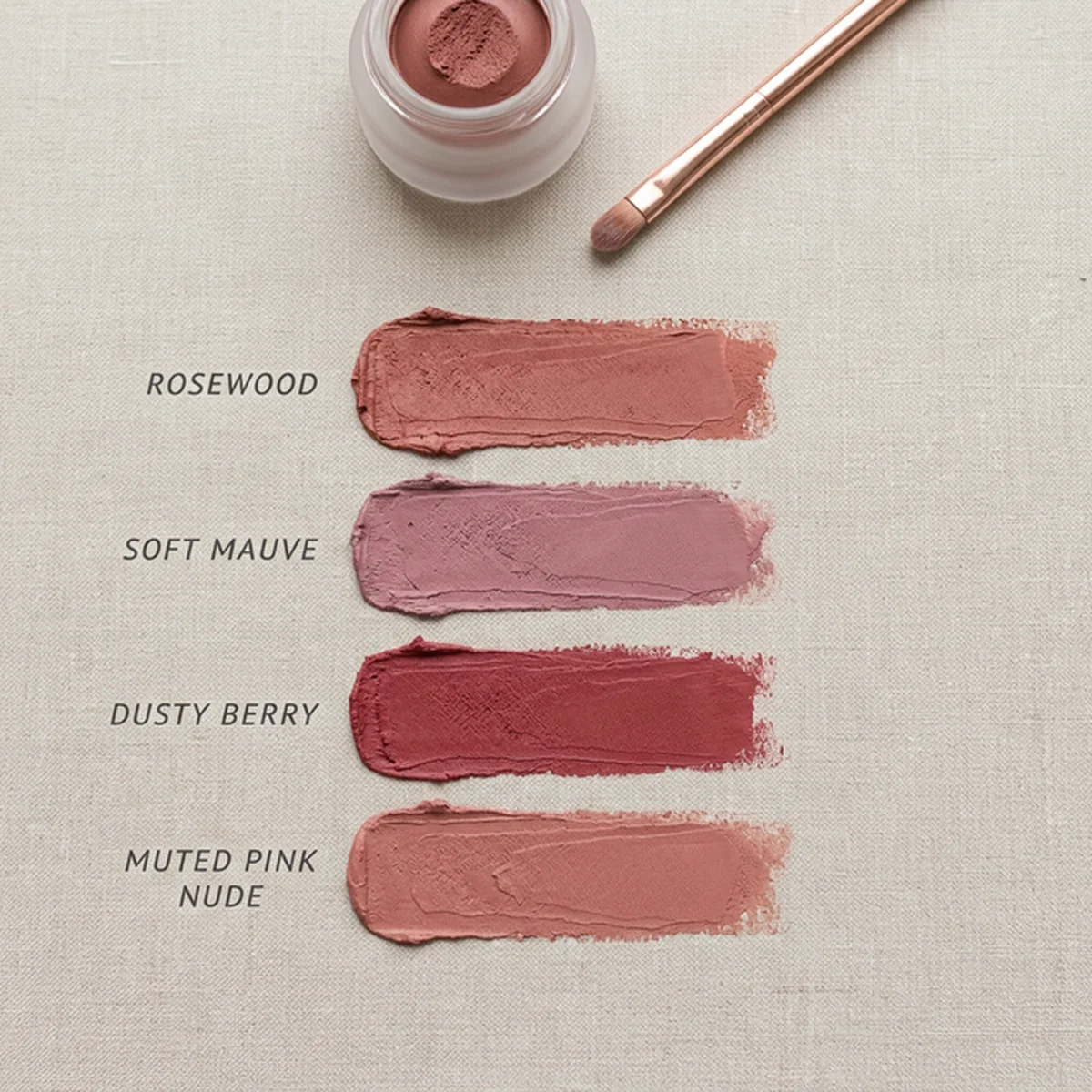 Soft Summer lipstick palette flatlay showing rosewood, soft mauve, dusty berry, and muted pink nude swatches