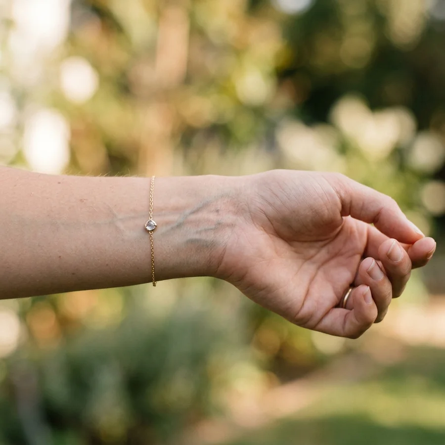 Close-up of a woman's wrist in natural sunlight showing vein color for undertone analysis