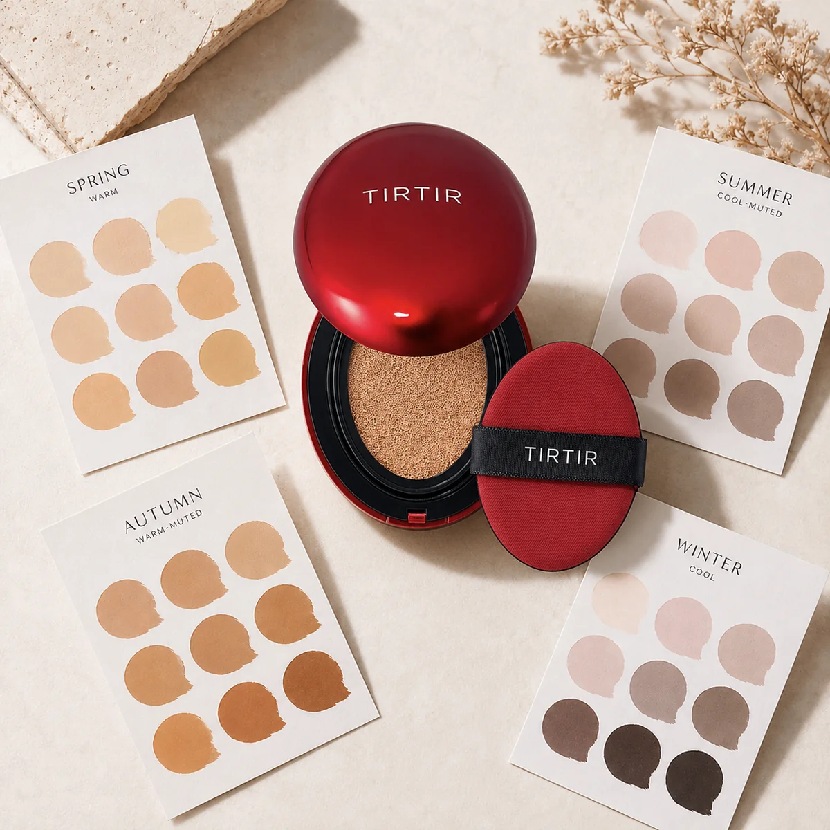 Flat lay of an open cushion foundation compact with color swatch cards in spring, summer, autumn, and winter tones